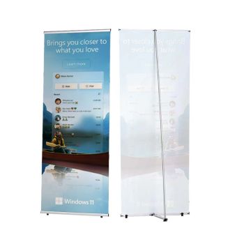 Portable standing banner display with blue sky and text design.
